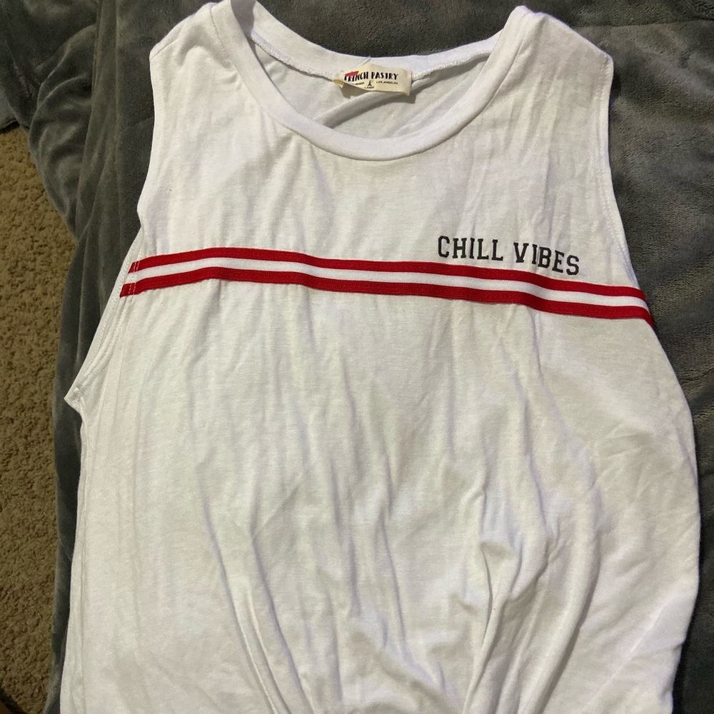 Tank top with a tie at the bottom.